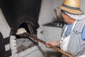 elder woman cooking traditional bread