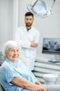 Elder woman with dentist in the dental office Royalty Free Stock Photo