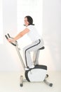 Elder woman on exercise bike