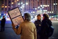 Elder woman with message at romanian protests, Bucharest, Romania