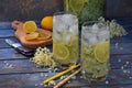 Elderberry flowers and lemon drink. Refreshment healthy elder juice. Glass of elderflower lemonade on wooden rustic board. Alterna