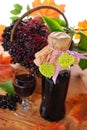 Elderberry juice and fresh fruits in the basket Royalty Free Stock Photo