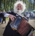 Elderly accordionist - singer of folk songs at the Bottom of the city in the Republic of Belarus. Royalty Free Stock Photo