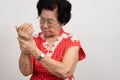 Elderly Asian woman patients suffer from numbing pain in hands from rheumatoid arthritis. Senior woman massage her hand with wrist