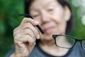 Elderly asian woman repair broken glasses