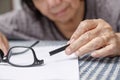 Elderly asian woman repair broken glasses Royalty Free Stock Photo