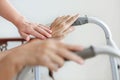 Elderly asian woman using a walker at home with caregiver Royalty Free Stock Photo