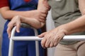 Elderly asian woman using a walker at home with daughter take ca Royalty Free Stock Photo