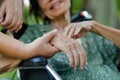 Elderly asian woman on wheelchair at home with daughter take care Royalty Free Stock Photo