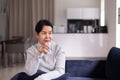 Elderly asian woman drinking water at home in the morning,Happy and smiling,Senior healthy care concept