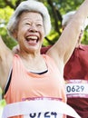 Elderly asian woman reaching the finish line Royalty Free Stock Photo