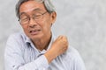 Elderly back neck and shoulder pain using hand to massage