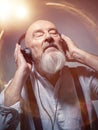 Elderly bald head man with headphones Royalty Free Stock Photo