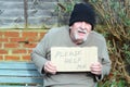 Homeless man with a cardboard help sign. Royalty Free Stock Photo