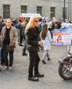 Elderly biker with long hair.