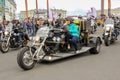 Elderly bikers on a unique three-wheeled bike