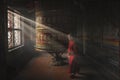 Elderly Buddhist nun during daily prayers at the mantra wheel at Boudhanath Monastery Royalty Free Stock Photo