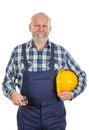 Elderly builder holding utensils