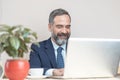 Elderly business man in a coffee shop Royalty Free Stock Photo