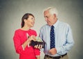 Elderly businessman boss and his beautiful young mistress Royalty Free Stock Photo