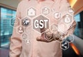 An elderly businessman chooses GST, Goods and Service Tax on the