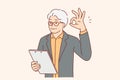 Elderly businessman showing OK gesture and holding clipboard checking work of subordinates Royalty Free Stock Photo