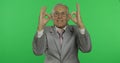 Elderly businessman showing ok gesture. Old man in formal wear giving okay sign Royalty Free Stock Photo