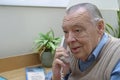 Elderly businessman on telephone