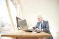 Elderly businessman working laptop Royalty Free Stock Photo