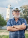 Elderly captain on the sea shore