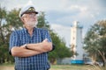 Elderly captain on the sea shore