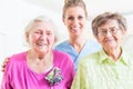 Elderly care nurse with two senior women