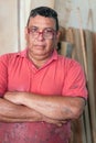 Carpenter posing at his workshop with his arms crossed Royalty Free Stock Photo