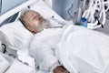 elderly caucasian male suffering from coronavirus or covid-19. bedridden patient