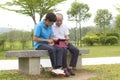 Elderly Chinese couple looking at the mobile tablet Royalty Free Stock Photo