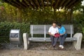 Elderly Chinese couple reading a mobile tablet together Royalty Free Stock Photo