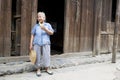 Elderly Chinese Lady Eating Cucumber Royalty Free Stock Photo