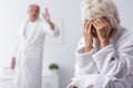 Elderly couple arguing in bedroom