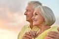 Elderly couple on the background of sky Royalty Free Stock Photo