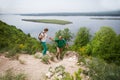 Elderly couple with backpacks travels around mountains. Royalty Free Stock Photo