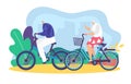 Elderly couple bicycling together in the park. Senior man and woman enjoying bike ride outdoors. Active seniors and