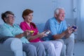 Elderly couple and caregiver playing Royalty Free Stock Photo