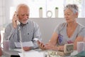 Elderly couple checking bills at home Royalty Free Stock Photo