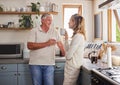 Elderly couple, coffee and kitchen smile, conversation and morning together in their home. Man, woman and retirement in Royalty Free Stock Photo