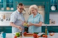 Elderly couple cooking a meal Royalty Free Stock Photo