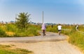 an elderly couple cycling for the Italian countryside