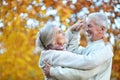 Elderly couple dancing in the autumn park Royalty Free Stock Photo