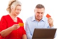 Elderly couple doing online shopping. Royalty Free Stock Photo