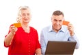 Elderly couple doing online shopping Royalty Free Stock Photo
