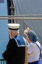 An elderly couple dressed in authentic world war two clothing